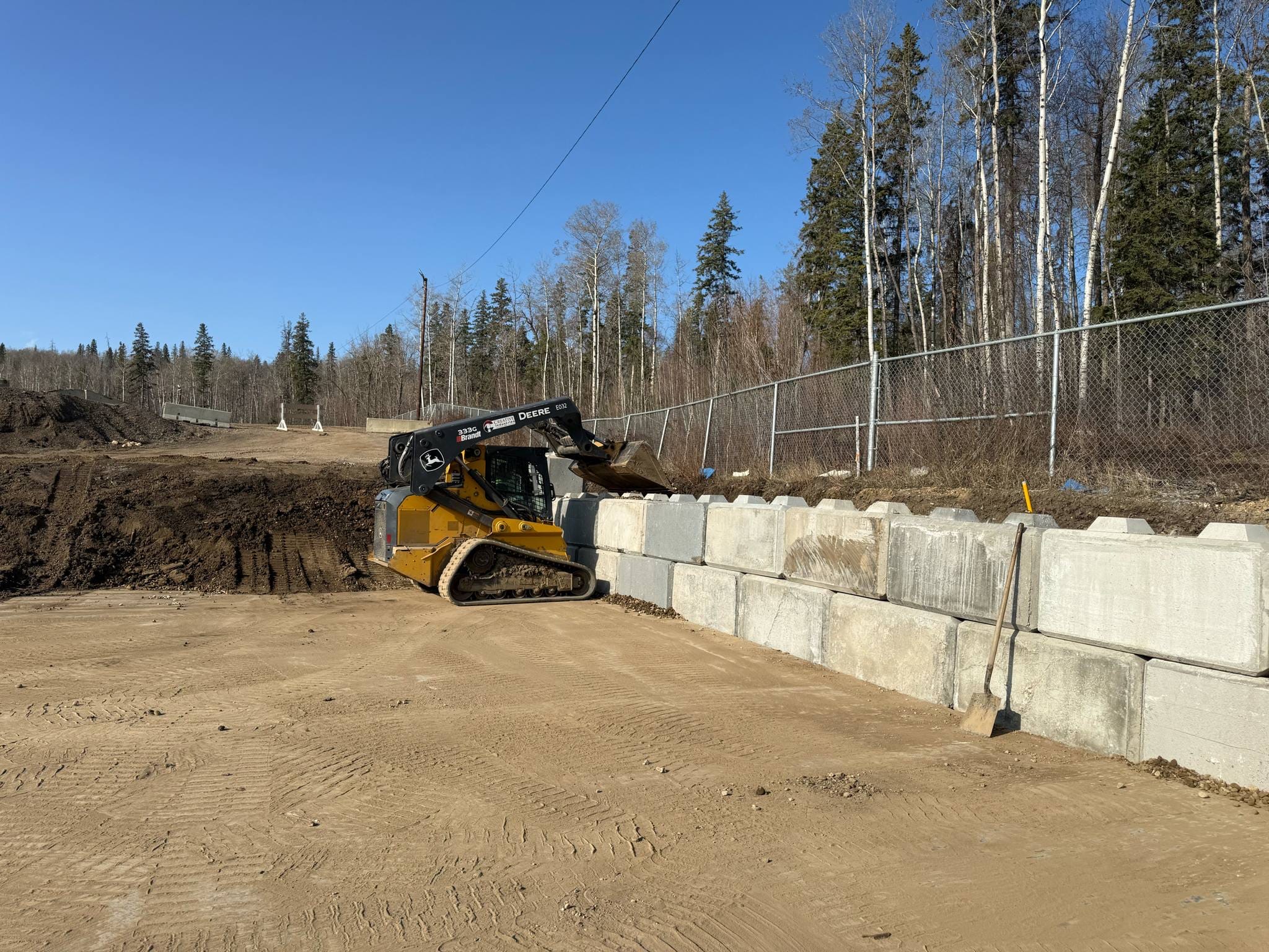 Block wall construction with skid steer